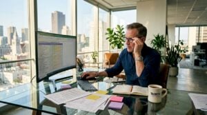 Tech executive reviewing assessment at desk