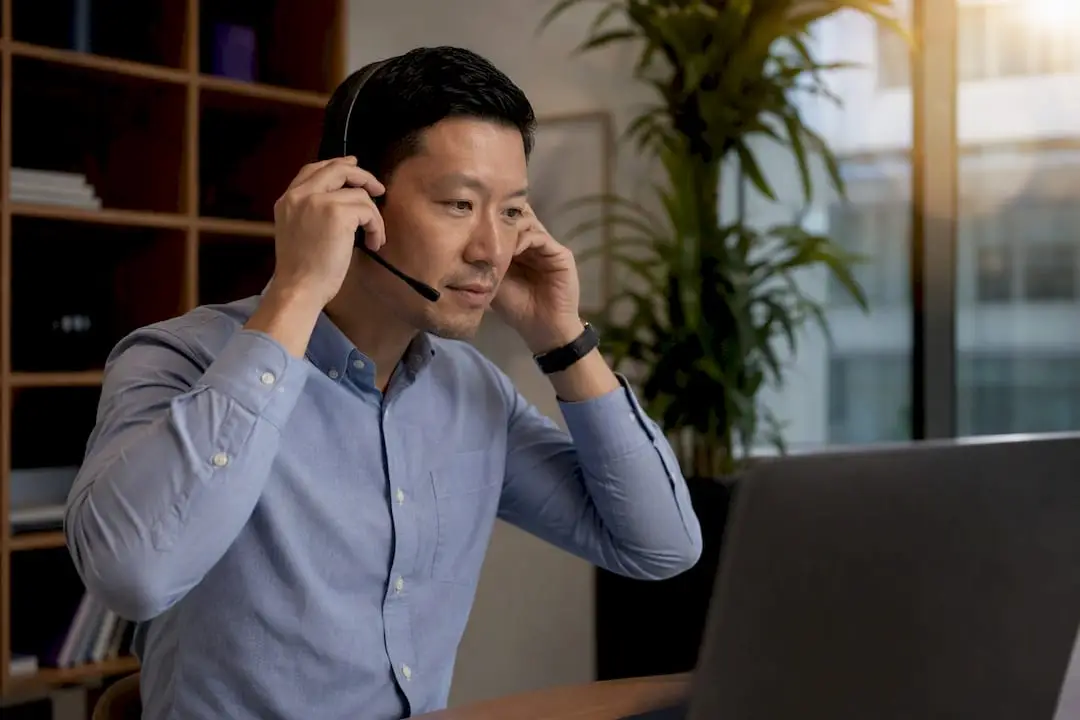CEO adjusting headset for virtual networking