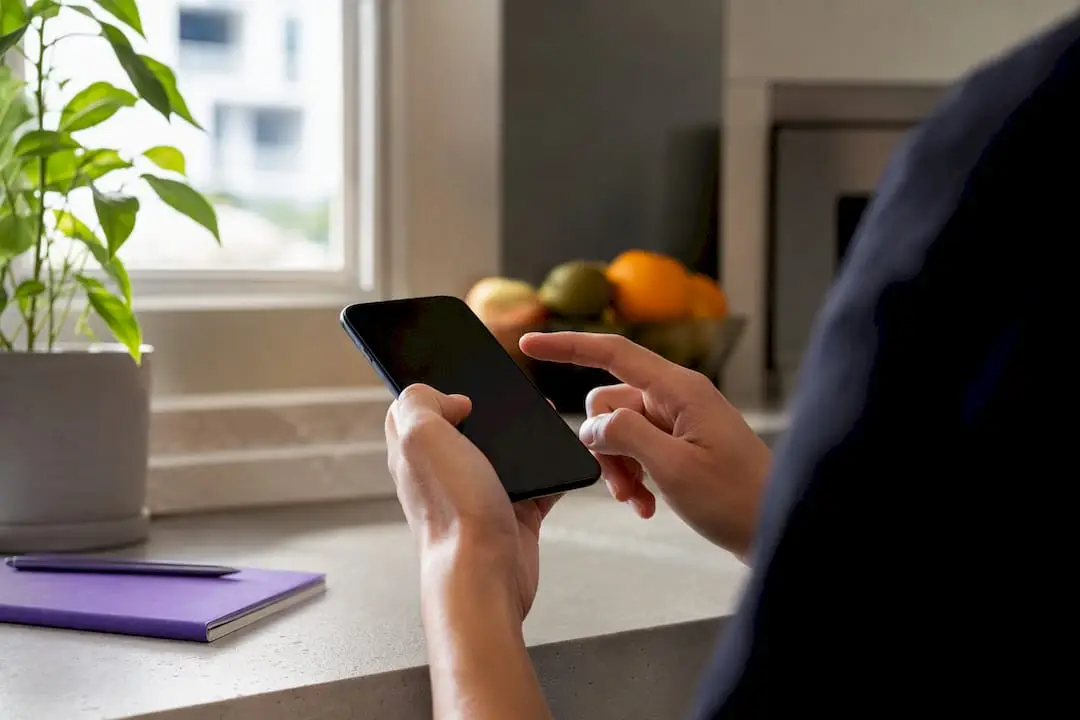 Hands adjusting resume keywords on tablet